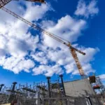 This image contains the structure for industrial construction site under the blue sky and bright sun