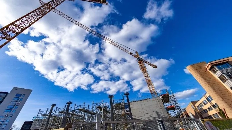 This image contains the structure for industrial construction site under the blue sky and bright sun