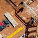 Lift manipulator unloads wooden delivered building