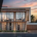 Modern front elevation design featuring expansive glass panels and stylish tiles, showcasing a contemporary architectural look with warm lighting and a landscaped exterior.