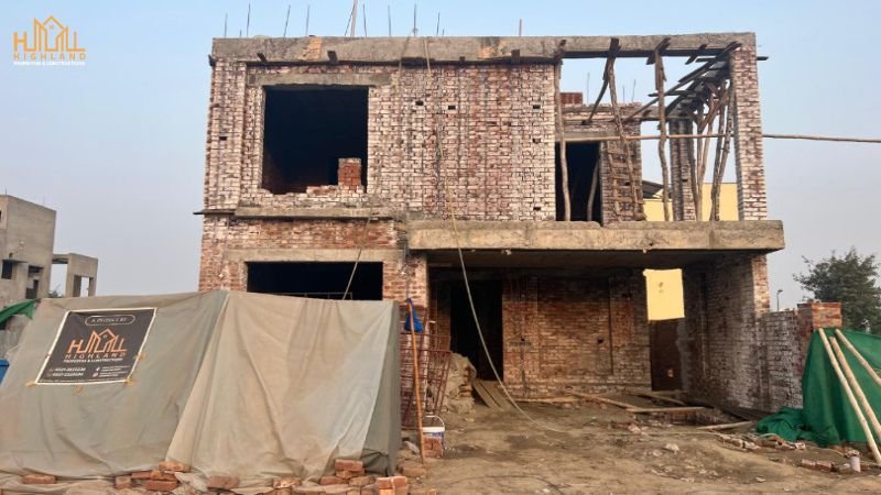 Under-construction house showcasing grey structure construction services in Lahore by Highland Properties & Constructions.