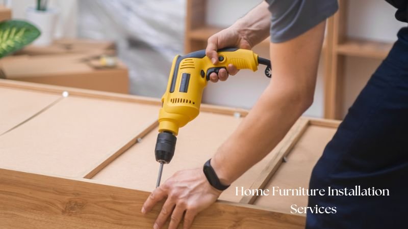 A professional carpenter using a yellow electric drill to assemble wooden furniture, representing expert Home Furniture Services in Islamabad, including installation and repair.