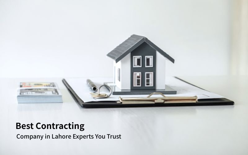 Model house placed on contract documents with pen and money, representing the Best Contracting Company in Lahore.