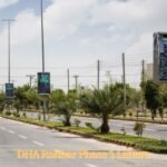 Wide road view with palm trees and modern street lights in DHA Rahbar Phase 1, Lahore.