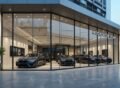 Modern car showroom exterior with full glass façade and luxury vehicles on display Car Showrooms Construction in Lahore