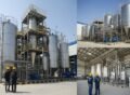 Modern edible oil and solvent plant construction in Pakistan showing stainless steel processing tanks, pipelines, and Pakistani engineers inspecting the facility.
