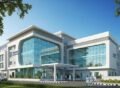 Modern hospital building exterior designed under Pharmaceutical & Hospitals Construction Services showcasing glass façade and contemporary architecture.