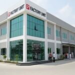 Modern textile and stitching unit building in Pakistan with glass front and industrial architecture representing a leading textile & stitching units construction company in Pakistan.