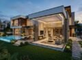 Modern luxury home showcasing Architectural & Interior Design in Lake City Lahore with elegant glass walls, spacious living areas, and contemporary landscaping.