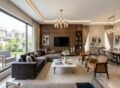 Modern luxury living room showcasing elegant Furniture Solutions in Fazaia Housing Scheme Lahore with stylish sofas, wooden TV wall, dining area, and premium interior design.