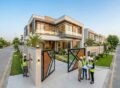 Modern luxury house construction in Agrics Town Lahore with engineers inspecting the project on-site.