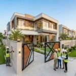 Modern luxury house construction in Agrics Town Lahore with engineers inspecting the project on-site.
