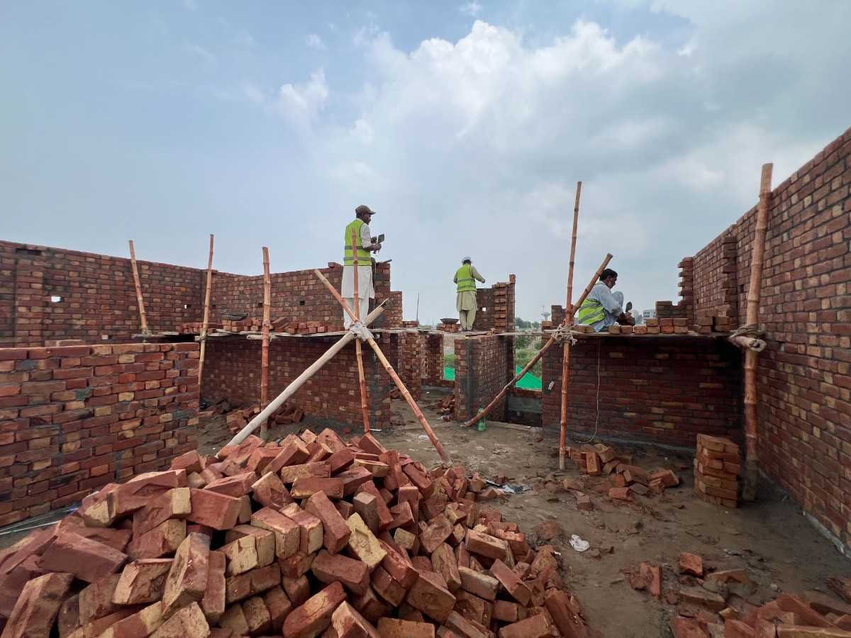 Brick masonry construction work at a Highland Construction project in Lahore