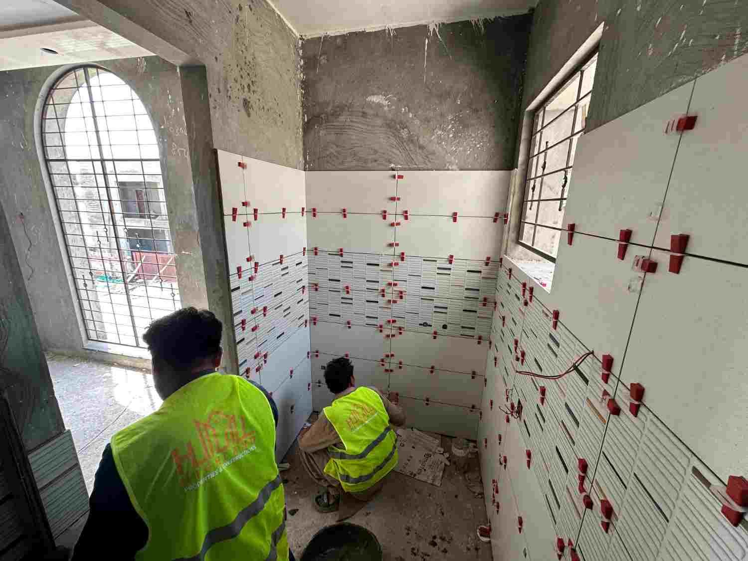 Tile work at a construction project in Lahore