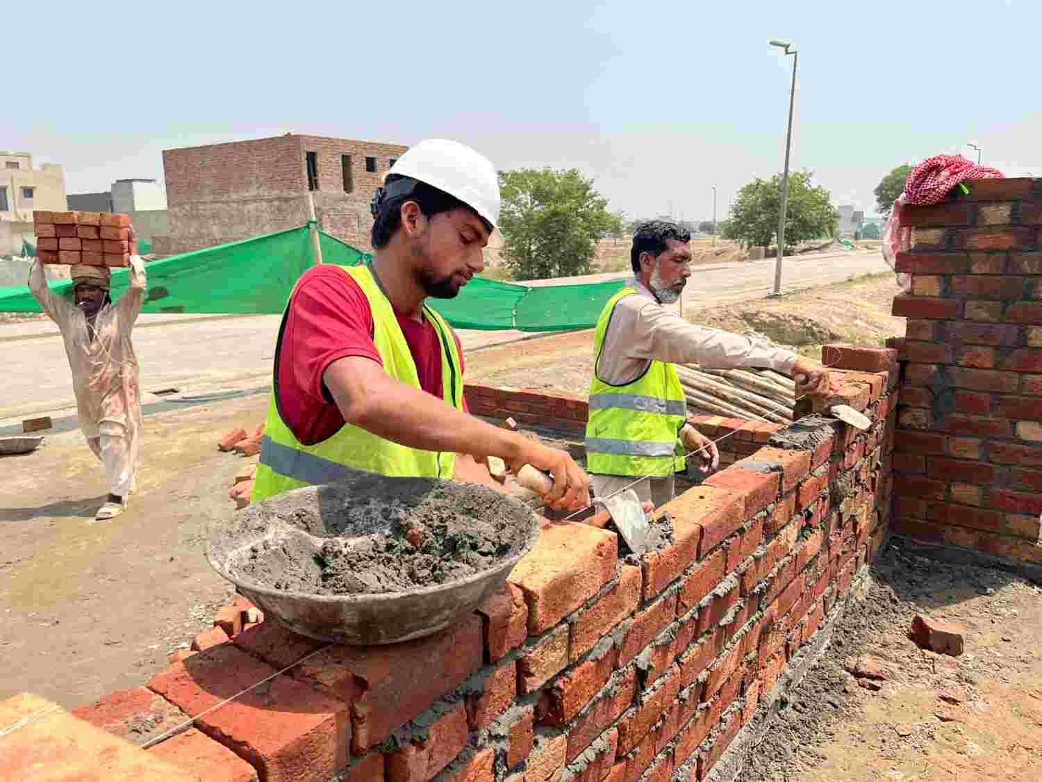 Wall building work at a construction project in Lahore